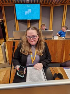 Georgia Miggins Welsh Youth Parliament Member sat in the Senedd